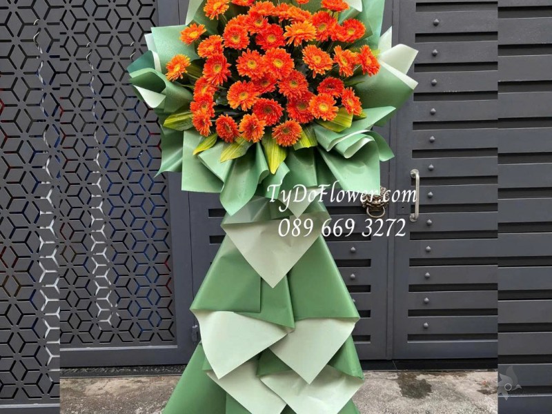 KCM0126023 KỆ HOA CHÚC MỪNG Thiết kế hoa đồng tiền cam