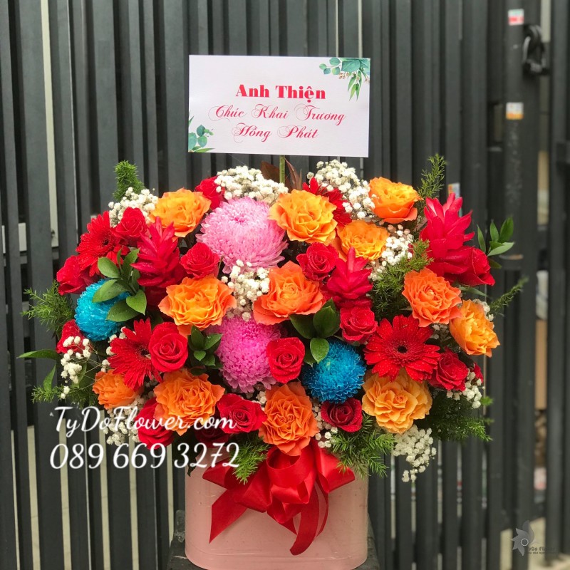 G122207 GIỎ HOA CHÚC MỪNG KHAI TRƯƠNG thiết kế hoa Cúc Mẫu Đơn hồng-xanh, hoa hồng cam Spirit Roses, hoa hồng đỏ, hoa hạnh phúc, hoa lá phụ tone màu đỏ xanh