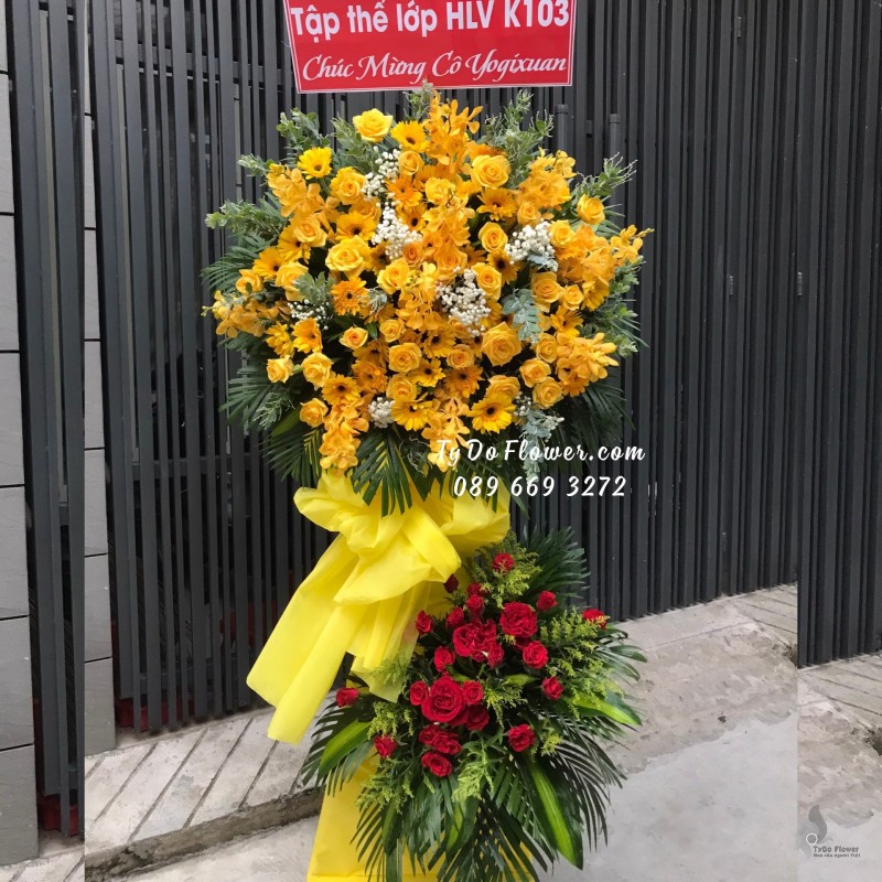 KCM01241254 KỆ HOA CHÚC MỪNG thiết kế tone màu đỏ-vàng chủ đạo Hoa Hồng Vàng, Hoa Lan Vàng