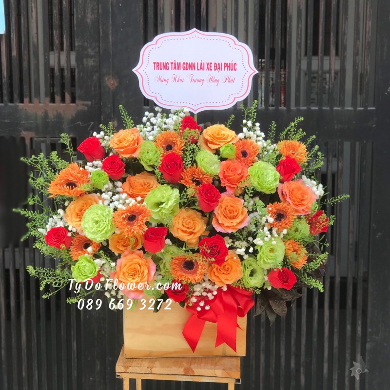 G02241357 GIỎ HOA CHÚC MỪNG KHAI TRƯƠNG HỒNG PHÁT thiết kế tone màu cam xanh, chủ đạo Hoa Hồng Cam Spirit Roses, Cát Tường Xanh Bơ