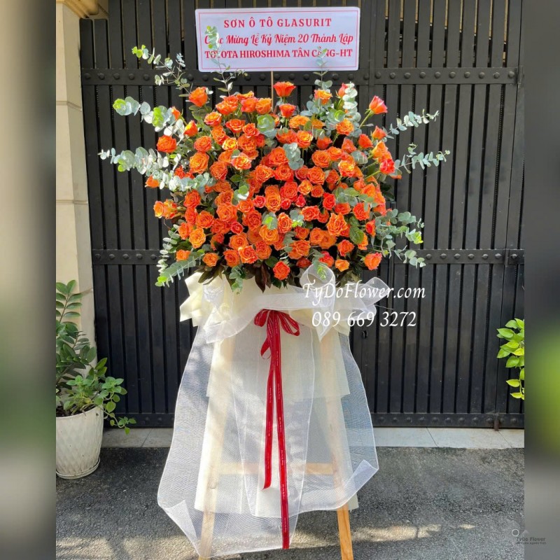 KCM1025859 KỆ HOA CHÚC MỪNG Thiết kế hoa hồng cam Spirit